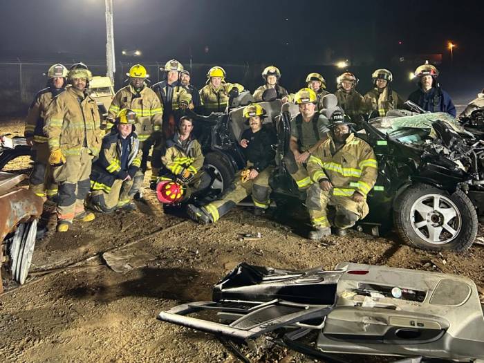 [City of Winona Firefighters recently train for Jaws of Life emergencies at Parker Wrecker Services.]