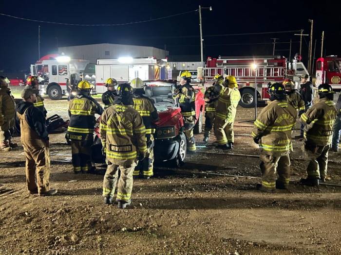 [City of Winona Firefighters recently train for Jaws of Life emergencies at Parker Wrecker Services.]