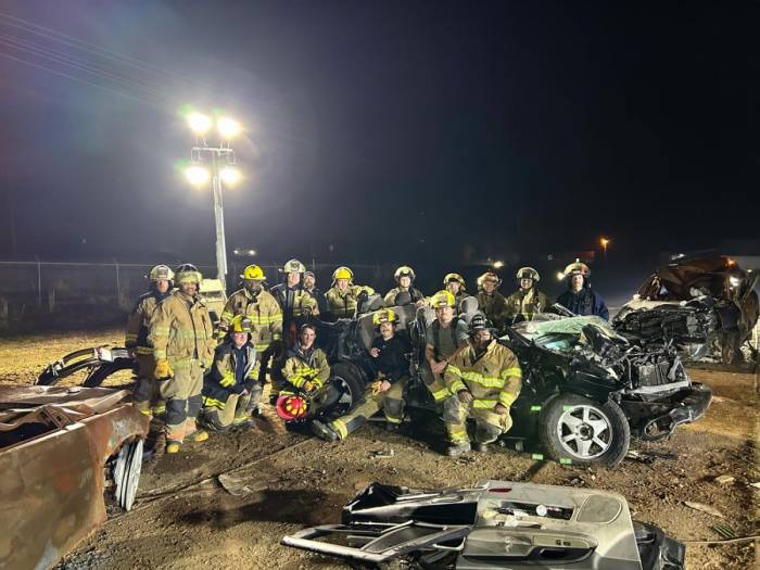 [City of Winona Firefighters recently train for Jaws of Life emergencies at Parker Wrecker Services.]